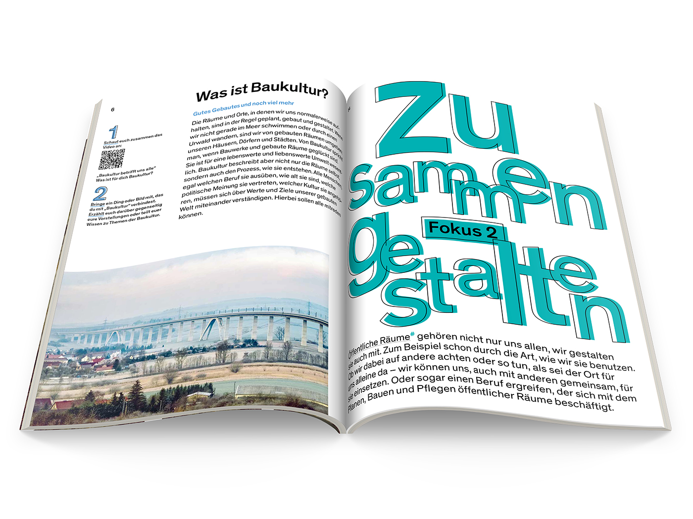 Aufgeschlagenes Schulbuch Baukultur mit Foto von einer Brücke und eine große grüne Überschrift